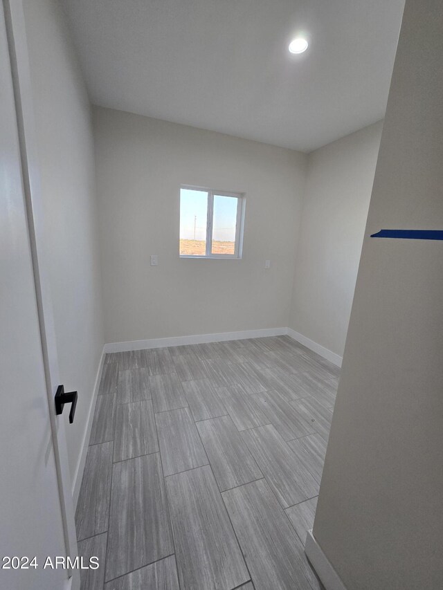 38422 W Buckeye Rd, Tonopah, AZ 85354 - unfurnished room featuring baseboards, recessed lighting, and wood finish floors