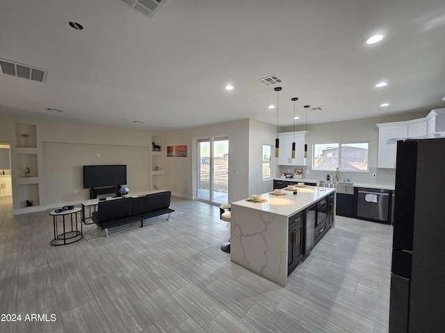 38422 W Buckeye Rd, Tonopah, AZ 85354 - kitchen with freestanding refrigerator, white cabinets, dishwasher, a sink, and visible vents