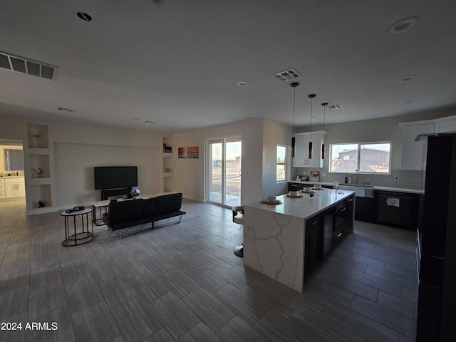 38422 W Buckeye Rd, Tonopah, AZ 85354 - kitchen with black appliances, visible vents, recessed lighting, and a center island