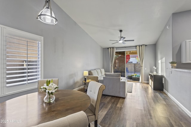 dining room with baseboards, a ceiling fan, and wood finished floors