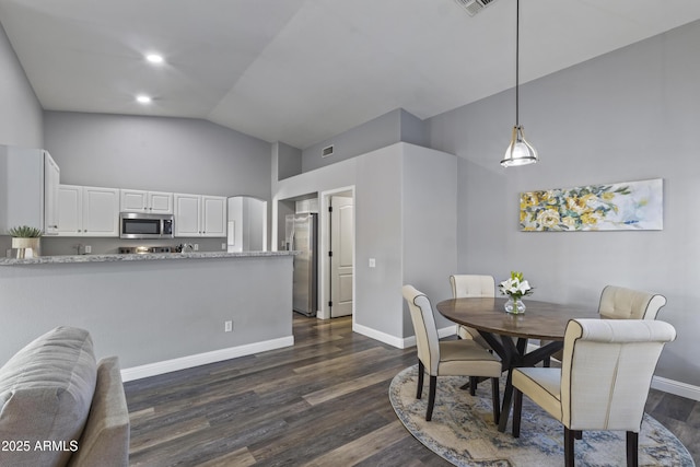 dining area with baseboards, dark wood finished floors, visible vents, and high vaulted ceiling