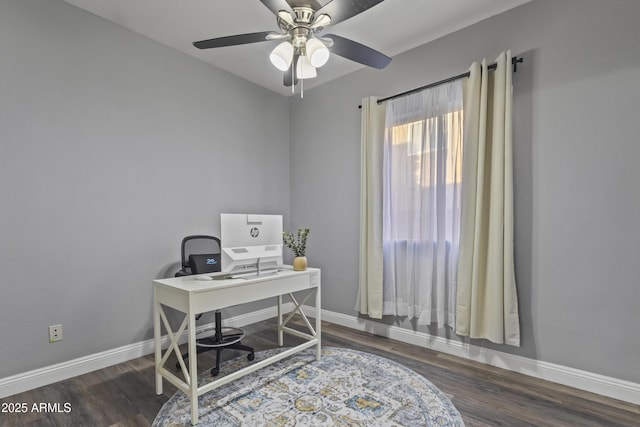 office area featuring baseboards, a ceiling fan, and wood finished floors