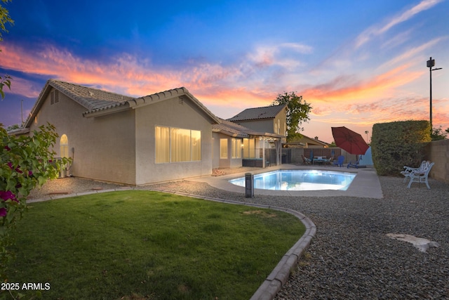 view of pool with a yard, a patio, a fenced in pool, and a fenced backyard
