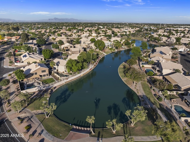 bird's eye view featuring a water and mountain view and a residential view