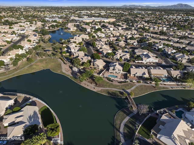 bird's eye view with a water and mountain view and a residential view