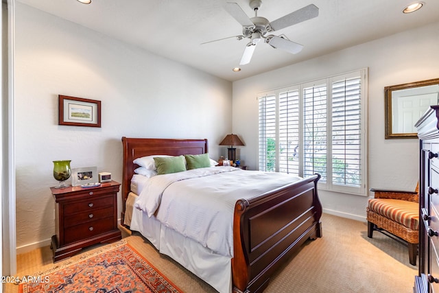 bedroom with light carpet, ceiling fan, recessed lighting, and baseboards