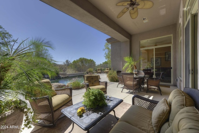 view of patio with an outdoor hangout area, outdoor dining space, and a ceiling fan