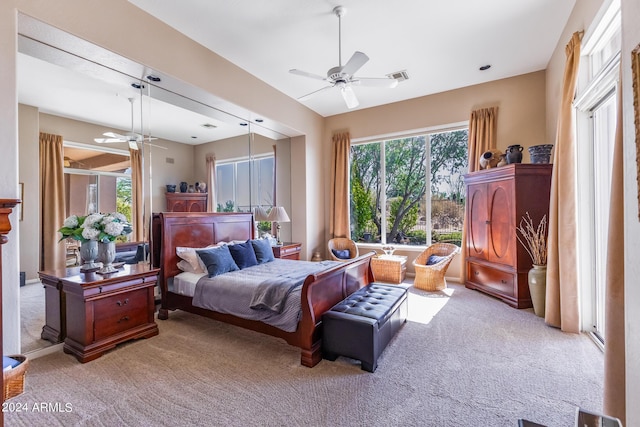 carpeted bedroom featuring visible vents and ceiling fan