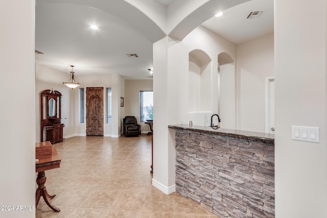 kitchen featuring pendant lighting and light tile patterned floors