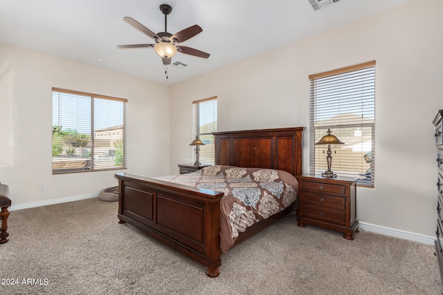 bedroom featuring light carpet and ceiling fan