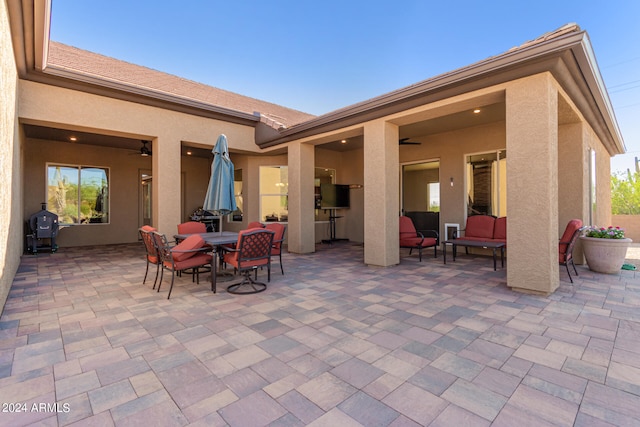 view of patio / terrace featuring ceiling fan