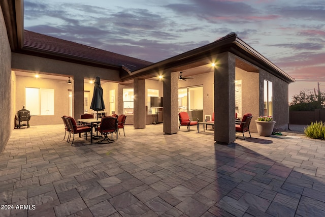 patio terrace at dusk with ceiling fan