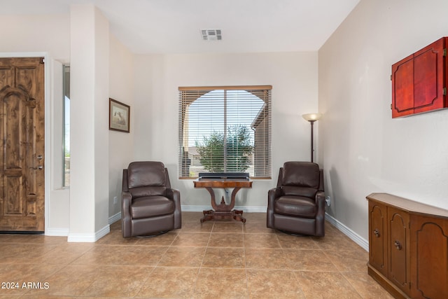 sitting room featuring light tile patterned floors