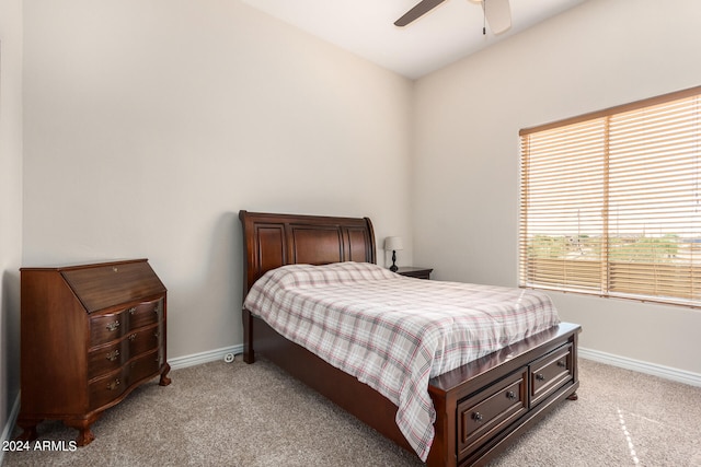 bedroom featuring ceiling fan and light carpet