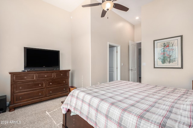 carpeted bedroom featuring ceiling fan and high vaulted ceiling