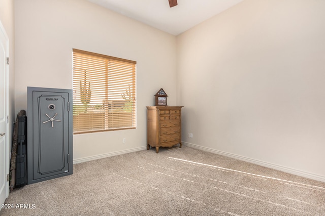 misc room with carpet floors and ceiling fan