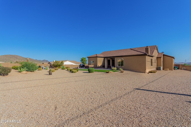 back of property featuring a mountain view