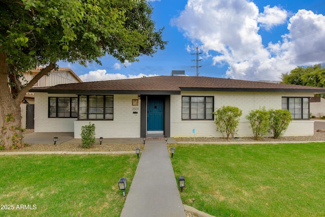 2501 E Campbell Ave, Phoenix, AZ 85016 - ranch-style home featuring a front yard, brick siding, and roof with shingles