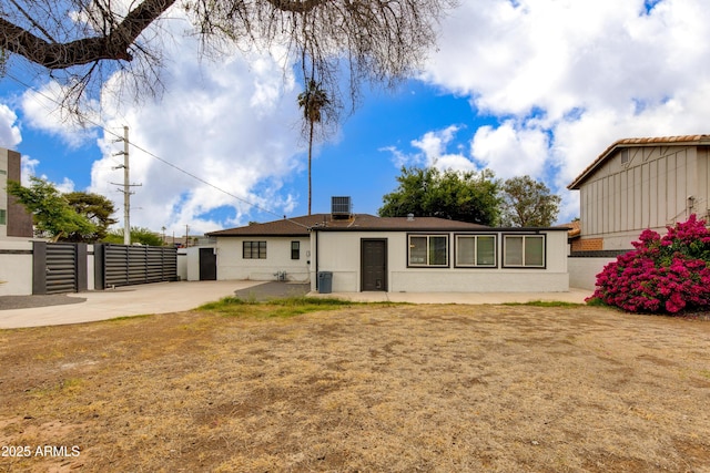 2501 E Campbell Ave, Phoenix, AZ 85016 - back of property featuring fence, a patio, and stucco siding