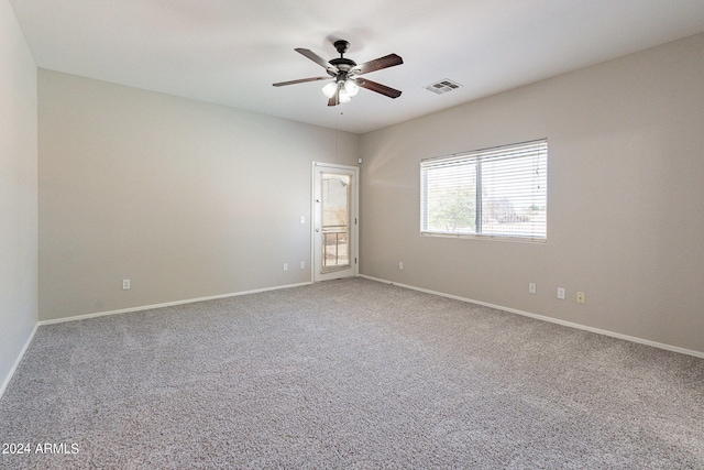 empty room with carpet floors and ceiling fan