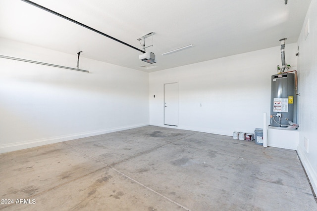 garage featuring water heater and a garage door opener