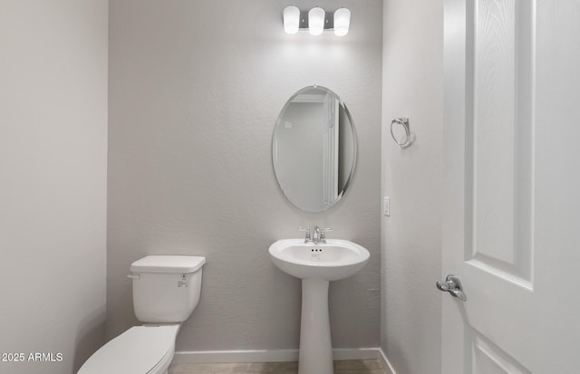 bathroom featuring toilet