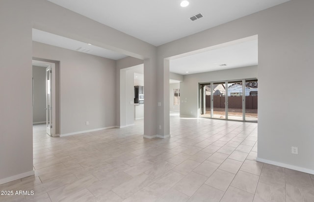 empty room with light tile patterned floors