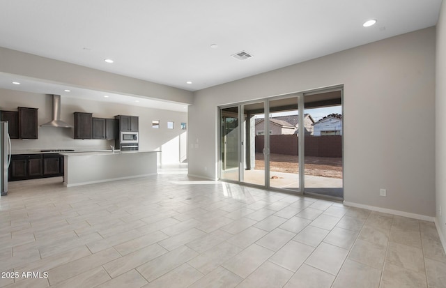 unfurnished living room with sink