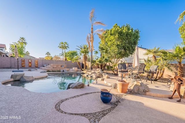 view of swimming pool with a patio area