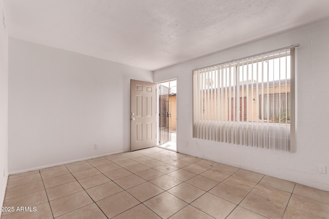 9847 N 11th Ave Unit 2, Phoenix, AZ 85021 - unfurnished room with light tile patterned floors