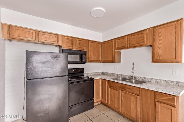 9847 N 11th Ave Unit 2, Phoenix, AZ 85021 - kitchen featuring black appliances, a sink, brown cabinetry, and light tile patterned flooring