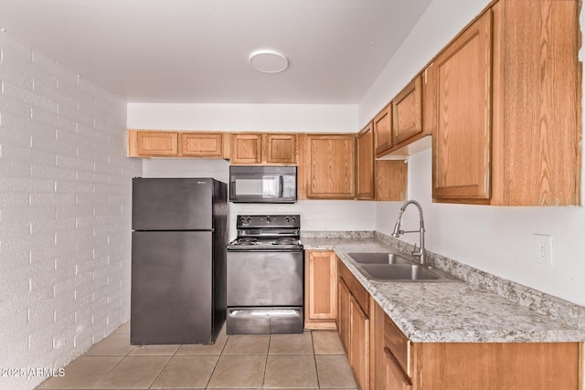 9847 N 11th Ave Unit 2, Phoenix, AZ 85021 - kitchen with freestanding refrigerator, black microwave, electric range, a sink, and light countertops