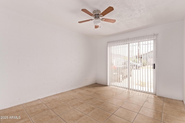 9847 N 11th Ave Unit 2, Phoenix, AZ 85021 - spare room with a ceiling fan, light tile patterned flooring, and a textured ceiling