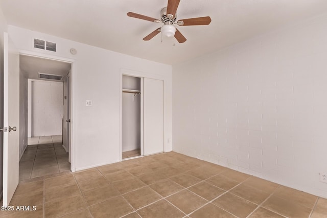 9847 N 11th Ave Unit 2, Phoenix, AZ 85021 - unfurnished bedroom featuring a closet, tile patterned floors, and ceiling fan