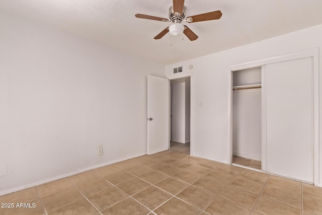 9847 N 11th Ave Unit 2, Phoenix, AZ 85021 - unfurnished bedroom featuring a closet, a ceiling fan, and tile patterned floors