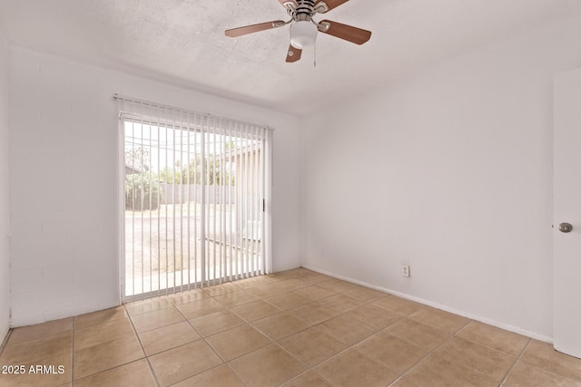 9847 N 11th Ave Unit 2, Phoenix, AZ 85021 - spare room featuring light tile patterned floors, a ceiling fan, and a textured ceiling