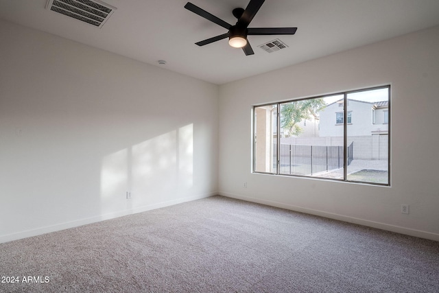 spare room with carpet flooring and ceiling fan