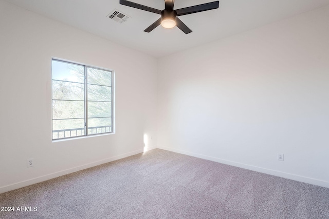 spare room with ceiling fan and carpet floors