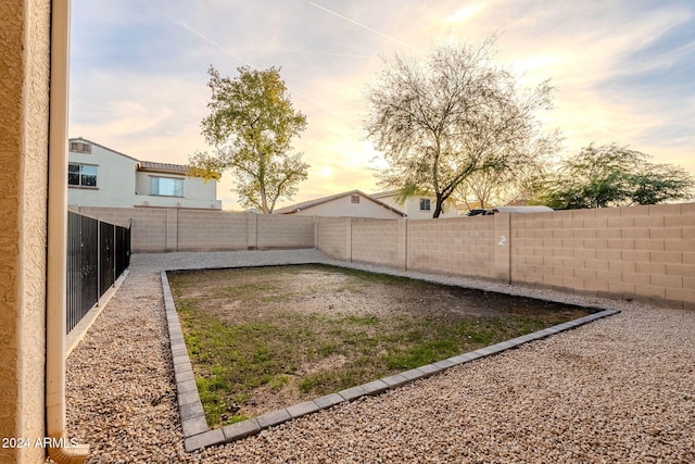 view of yard at dusk