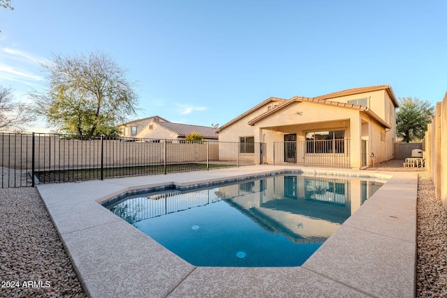 view of swimming pool featuring a patio area