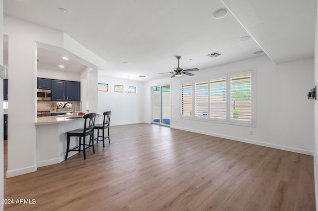 interior space featuring light hardwood / wood-style flooring and ceiling fan