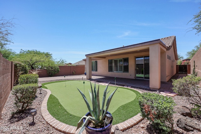 rear view of property featuring a patio area