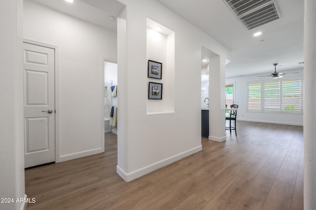 hallway featuring wood-type flooring