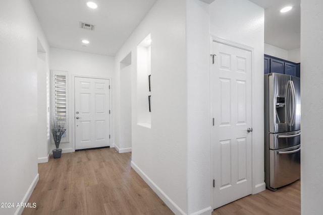 hallway featuring light wood-type flooring