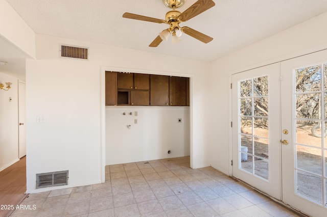 laundry room with cabinets, washer hookup, ceiling fan, electric dryer hookup, and french doors