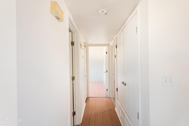 hallway featuring wood-type flooring
