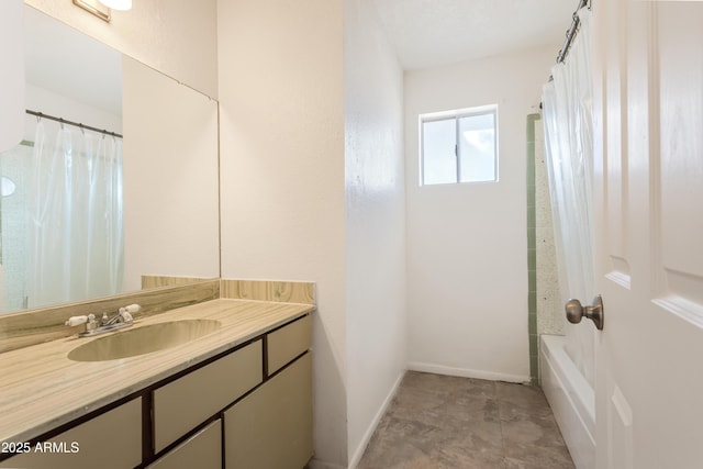 bathroom featuring vanity and shower / bathtub combination with curtain