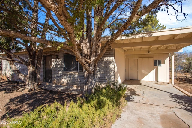 view of front of home featuring a carport