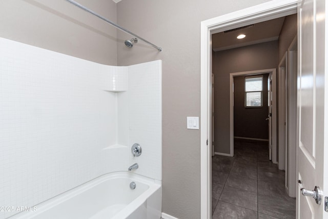 bathroom with tile patterned floors and shower / bathtub combination