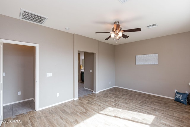 unfurnished bedroom with ceiling fan and light hardwood / wood-style floors